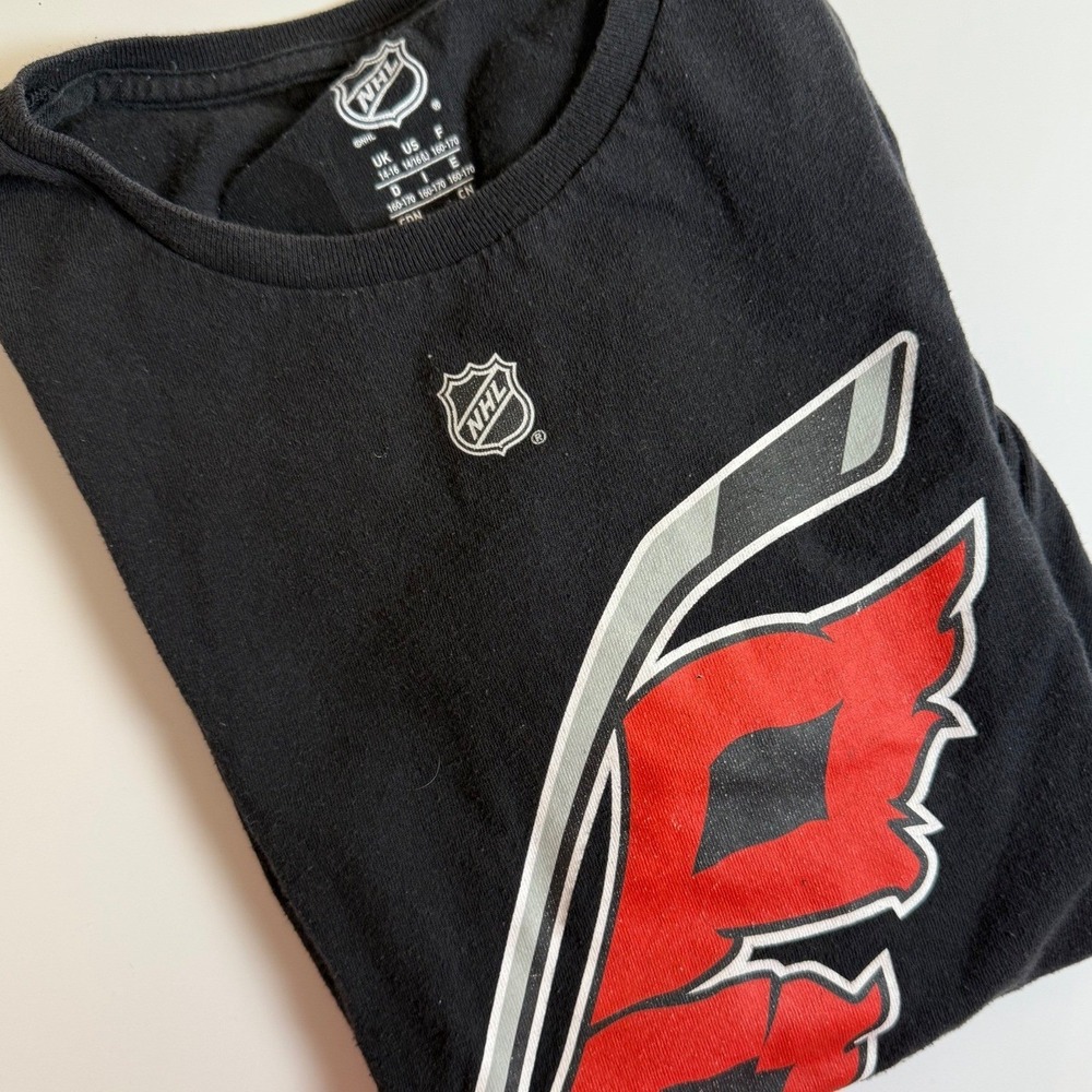 Carolina Hurricanes Aho 20 NHL T Shirt Black Youth Medium 14/16